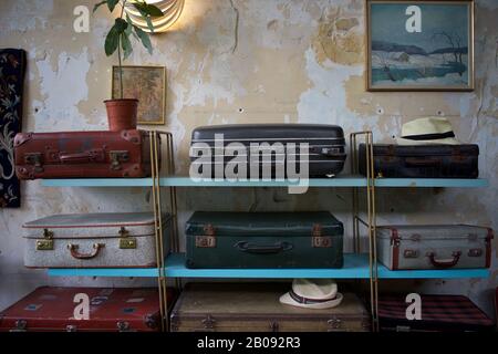 Old suitcases displayed on Formica shelves, Paris, France Stock Photo