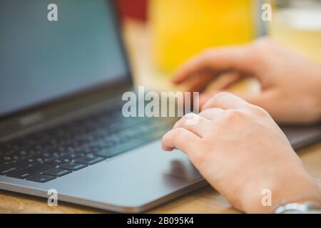 woman hand on laptop touchpad close up Stock Photo