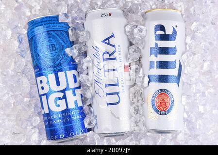 IRVINE, CALIFORNIA - MARCH 29, 2018: Three of the most popular Light beers in a bed of ice. King cans of Bud Light, Michelob Ultra, and Miller Lite. Stock Photo