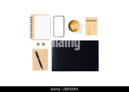 Workspace with notebook, laptop, smartphone, coffee cup and pen, envelope on white background. Stock Photo