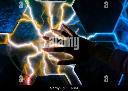 Woman touching plasma panel display Stock Photo