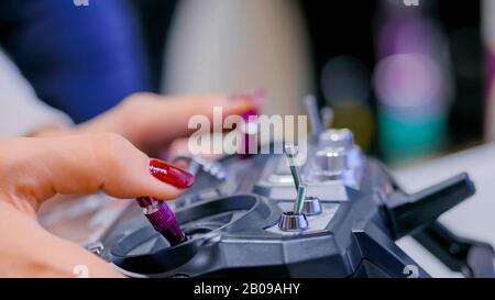 Woman using joystick or gamepad Stock Photo