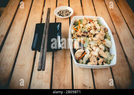 Yakissoba,  a traditional chinese food dish in a wood table Stock Photo