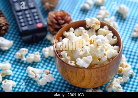 top view of popcorn and tv remote on table Stock Photo