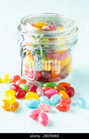 Fruity jellybeans. Tasty colorful jelly beans in glass jar. Stock Photo