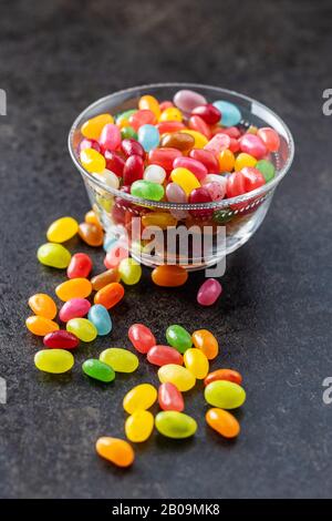 Fruity jellybeans. Tasty colorful jelly beans in glass bowl. Stock Photo