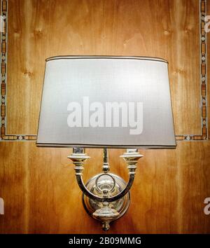 Lamp, sconce against a wooden wall Stock Photo