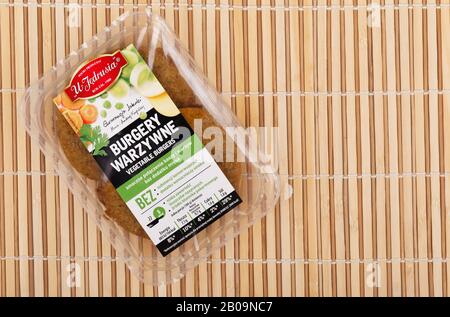 RZESZOW, PODKARPACKIE POLAND - 9 NOVEMBER 2019: Packaging and contents of Vegetarian Burgers U Jedrusia on wooden table Stock Photo