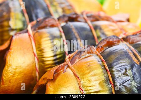 Appetizing smoked fish on a platter Stock Photo