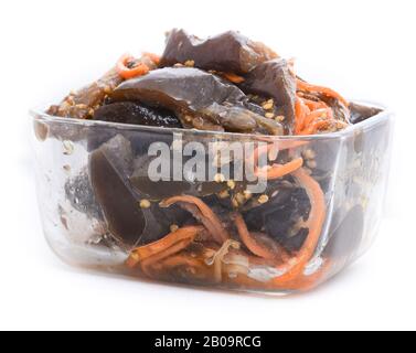 Roasted and marinated vegetables salad with carrot in a glass bowl Stock Photo