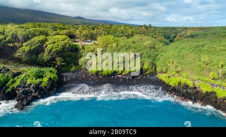 An aerial view of the black sand beach at Waianapanapa State Park, Hana, Maui, Hawaii. Stock Photo