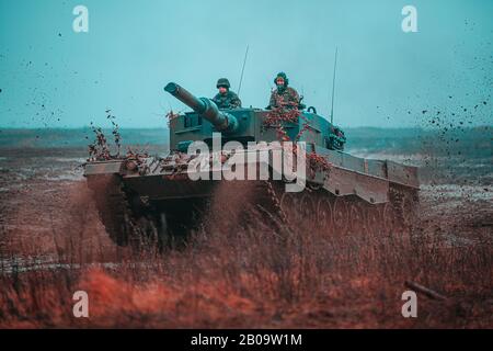 Polish Soldiers, assigned to the 1st Warsaw Armored Brigade operate a Leopard 2 tank during a multinational training scenario in support of NATO enhanced Forward Presence Battle Group Poland February 6, 2020 in Bemowo Piskie, Poland. The NATO enhanced Forward Presence consists of four battalion-sized battle groups deployed on a persistent rotational basis to Estonia, Latvia, Lithuania and Poland. Stock Photo