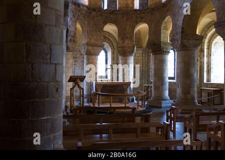 Inside of St Johns Chapel in the tower of london with a bit of soft warm light coming in thru the  windows Stock Photo