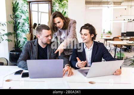 Businessteam working together on project Stock Photo