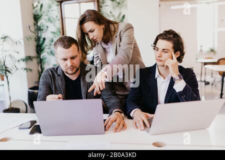 Businessteam working together on project Stock Photo