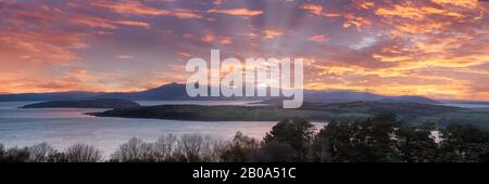 From above largs golf club on Routenburn Road is sunset on Majestic Arran. Stock Photo