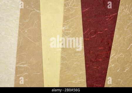 collection of  handmade Indian paper created from recycled cotton fabric with silk fibers, various tones of brown color Stock Photo