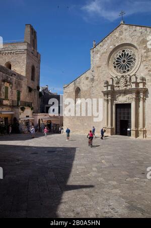 The 11th century cathedral ( right )  at Otranto, a coastal  town in the Apulia region of Southern Italy. June 2018 Stock Photo