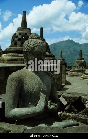 INDONESIA, JAVA, ANCIENT BOROBUDUR BUDDHIST TEMPLE, UPPER TER- RACE WITH BELL STUPAS Stock Photo