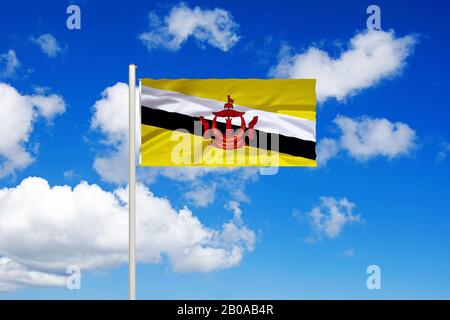 flag of Brunei in front of blue cloudy sky, Sultanate of Brunei, Brunei Darussalam Stock Photo