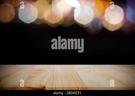 Empty wood table over bokeh at night for product display montage. Stock Photo