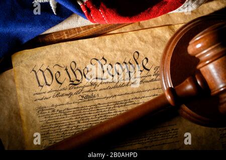 The American constitution, a gavel, and the United States flag Stock Photo