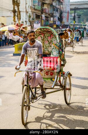 Chittagong, Bangladesh, December 22, 2017: typical steet life with rickshaw traffic  in Chittagong, Bangladesh Stock Photo