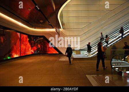 In the on the pedestrian passage from Wynyard train station to Barangaroo, Sydney is a wide-screen public art, video installation 'Wynscreen' Stock Photo