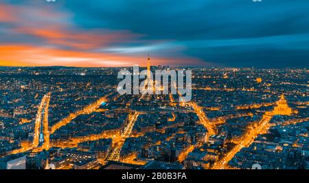 Paris aerial view with Eiffel Tower at night, Skyline of Paris with Eiffel Tower at sunset in Paris, France. Architecture and landmarks of Paris.