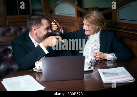 Business people talking over coffee in a cafe Stock Photo