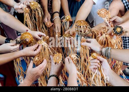 Different ages and nationalities females hands keeping their weaving craft after the workshop together staying in a circle. Diversity and inclusion. Women multicultural community in Australia. Stock Photo