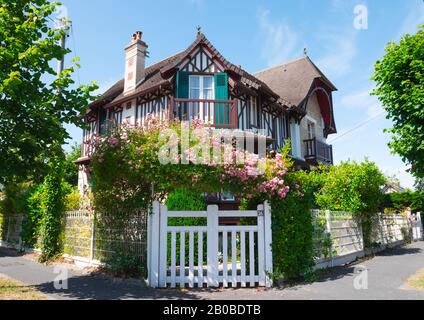 Beautiful typical house in Cabourg, Lower Normandy, France. July 2019. Sunny summer day. This mansion/house has a unique european timber framing Stock Photo