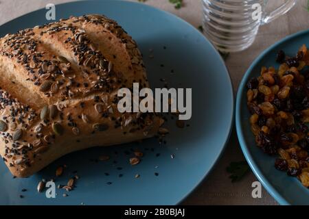 paved bread on a blue plate with dark lighting Stock Photo