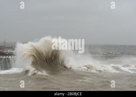 Huge waves breaking inside Newhaven Harbour during Storm Ciara on 9th February 2020 Stock Photo
