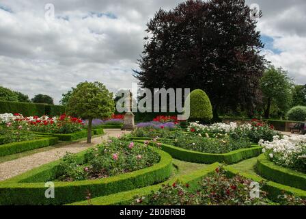 A formal English garden in Summer at Grimsthorpe Castle, Lincolnshire, UK