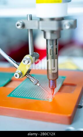 soldering iron tips of automated manufacturing soldering and assembly pcb board Stock Photo