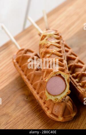 Pile of freshly fried corndogs. Delicious snack Stock Photo