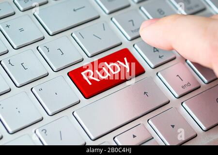 button with the ruby on the grey keyboard of a modern laptop. Stock Photo