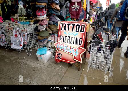 London, England, UK. Tattoos and Piercings sign in Camden High Street Stock Photo