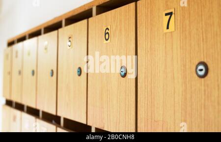 Mailboxes on the wall in the entrance of the house. Stock Photo