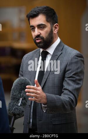 Edinburgh, UK. 20th Feb, 2020. Pictured: Humza Yousaf MSP - Cabinet Minister for Justice. Live TV interview at the Scottish Parliament in Holyrood, Edinburgh. Credit: Colin Fisher/Alamy Live News Stock Photo