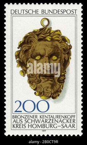 Postage stamp with serrated edge, on a white background the image of a Roman bronze head of Schwarzenacker from the collections of the Historisches Museum der Pfalz in Speyer., Stamp, paper, 4,3 x 2,5 cm, circulation 8,900,000, modern 16 August 1977 Stock Photo