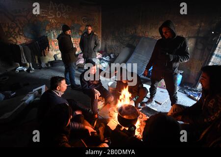 Bihac, Bosnia and Herzegovina. 7th Feb, 2020. Egyptian refugees keep warm in an abandoned building at Bira camp in Bihac.Bihac in north west Bosnia and Herzegovina is one of the epicenters of migrating refugees along the Balkan Route with so many refugees from a variety of countries, tension is rising between the various nationalities. The Bosnian population is surprisingly tolerant despite their picturesque town being abused. Credit: Iain Burns/SOPA Images/ZUMA Wire/Alamy Live News Stock Photo