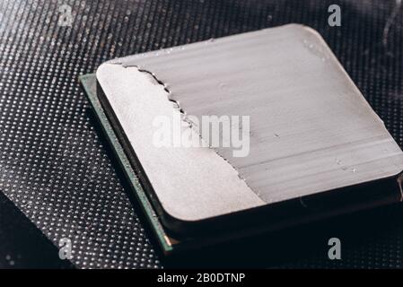 The processor of the computer with the thermal paste applied on it. Details of the computer's system unit Stock Photo