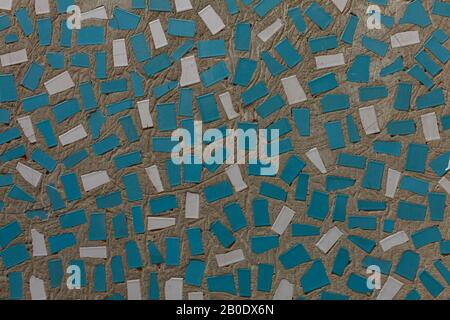 Abstract mosaic on the wall. Blue, white rectangles in a chaotic manner Stock Photo