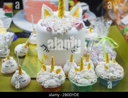 Unicorn cake and pastries. Confectionery shop decoration Stock Photo