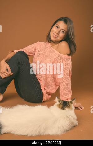 Happy beautiful multi ethnic woman with short hair smiling Stock Photo