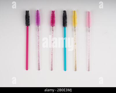 lots of eyelash brushes, tools for women's eyelash extensions. Stock Photo