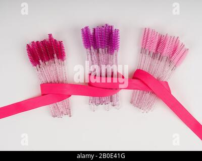 lots of eyelash brushes, tools for women's eyelash extensions. Stock Photo