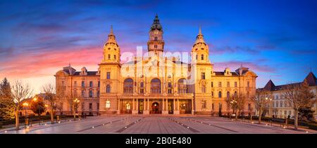 Gyor, Hungary. Panoramic cityscape image of Gyor downtown with Gyor Town Hall during beautiful sunrise. Stock Photo